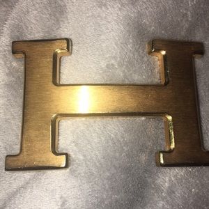 H gold belt buckle